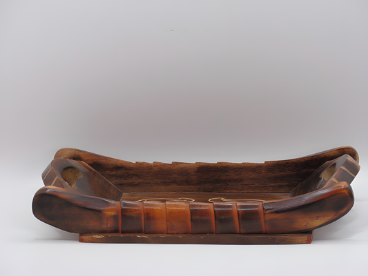 Wooden tray with decorative patterns on a white background